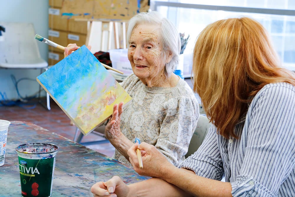 Senior women painting together
